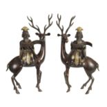 A LARGE PAIR OF LATE 19TH CENTURY PATINATED BRONZE KOROS