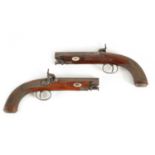 A CASED PAIR OF EARLY 19TH CENTURY PERCUSSION PISTOLS BY MOORE, LONDON.