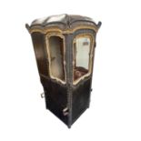 AN EARLY/MID18TH CENTURY CARVED GILT-WOOD AND STUDDED LEATHER SEDAN CHAIR