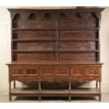 AN IMPRESSIVE LATE 17TH/EARLY 18TH CENTURY MONMOUTHSHIRE JOINED OAK DRESSER AND RACK OF GENEROUS P