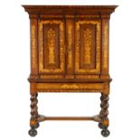 AN EARLY 18TH CENTURY WALNUT AND FLORAL MARQUETRY DUTCH CABINET ON STAND