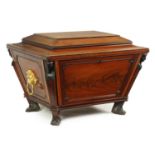 A GOOD REGENCY INLAID FLAMED MAHOGANY SARCOPHAGUS WINE COOLER