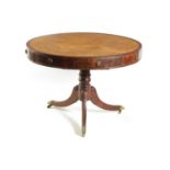 A REGENCY FLAME MAHOGANY DRUM TABLE
