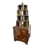 AN UNUSUAL REPRODUCTION REGENCY STYLE BRASS MOUNTED FIGURED MAHOGANY OPEN TOP BOOKCASE