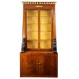 AN UNUSUAL REGENCY MAHOGANY AND GILT BRASS MOUNTED DISPLAY CABINET WITH BOOKCASE IN THE EGYPTIAN TAS