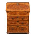 AN EARLY 18TH CENTURY WALNUT AND FLORAL MARQUETRY PANELLED BUREAU OF SMALL SIZE