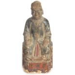 A CHINESE MING PERIOD CARVED WOODEN FIGURE OF AN IMMORTAL