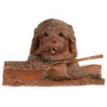 A 19TH CENTURY BLACK FOREST CARVED LINDENWOOD INKWELL FORMED AS DOG RESTING ON A LOG