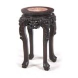 A SMALL 19TH CENTURY PROFUSELY CARVED CHINESE HARDWOOD CIRCULAR JARDINIERE STAND