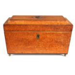 A REGENCY AMBOYNA AND EBONY STRUNG SARCOPHAGUS.TEA CADDY