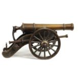 A 19TH CENTURY BRONZE AND CAST IRON STARTING CANNON