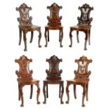 A RARE SET OF SIX COUNTRY HOUSE MAHOGANY HALL CHAIRS