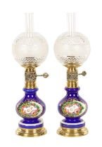 A PAIR OF 20TH-CENTURY BLUE GLASS OIL LAMPS/ELECTRIC TABLE LAMPS