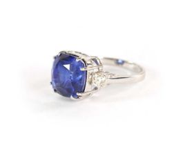 AN IMPRESSIVE 18CT WHITE GOLD 12CT SAPPHIRE AND DIAMOND RING