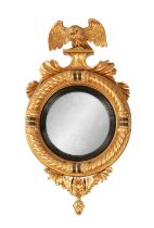 A REGENCY GILT CARVED WOOD CONVEX HANGING MIRROR