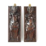 A PAIR OF 17TH CENTURY DUTCH CARVED WALNUT FIGURES