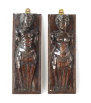 A PAIR OF 17TH CENTURY DUTCH CARVED WALNUT FIGURES