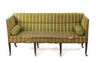 A GEORGE III UPHOLSTERED AND MAHOGANY FRAMED THREE SEATER COUNTRY HOUSE SETTEE