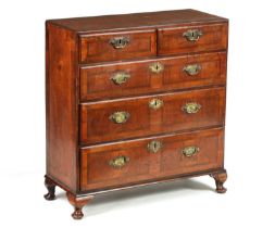AN EARLY 18TH-CENTURY FIGURED WALNUT BACHELOR'S CHEST