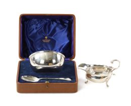 A GEORGE VI CASED PLAIN SILVER PORRINGER AND SPOON