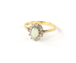 A .750 HALLMARKED YELLOW GOLD OPAL AND DIAMOND DRESS RING