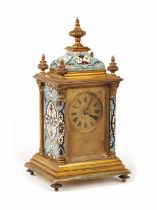 A LATE 19TH CENTURY FRENCH GILT BRASS AND CHAMPLEVE ENAMEL CARRIAGE STYLE MANTEL CLOCK