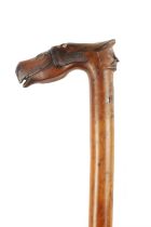 A 19TH CENTURY CARVED FRUIT WOOD FOLK ART WALKING STICK