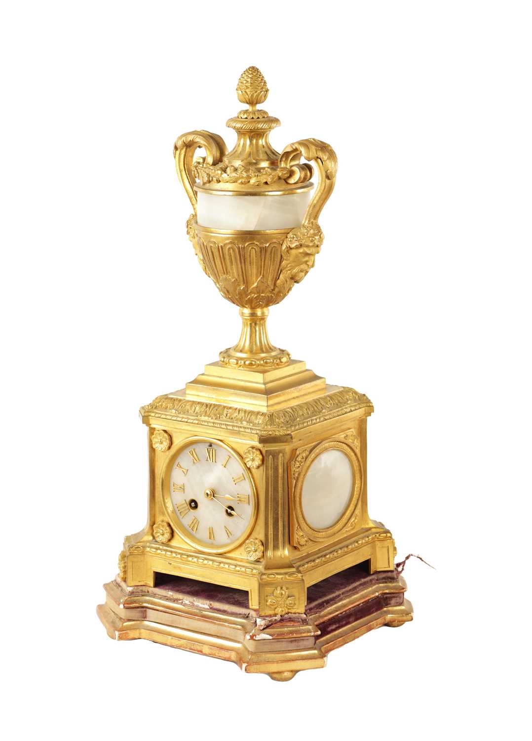 A 19TH CENTURY ORMOLU AND ONYX PANELLED MANTEL CLOCK