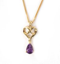 A .375 HALLMARKED YELLOW GOLD AND AMETHYST PENDANT WITH FINE LINK CHAIN