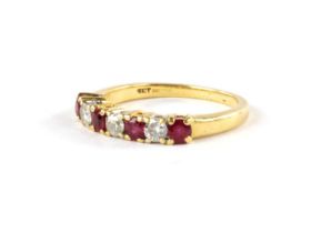 AN 18CT YELLOW GOLD LADIES SEVEN STONE DIAMOND AND RUBY DRESS RING