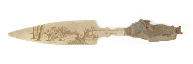 WAR SOUVENIER. A STEEL KNIFE WITH ENGRAVED CANNON ON THE BLADE MADE FROM A PIECE OF SHRAPNEL