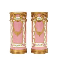 A PAIR OF 19TH CENTURY SEVRES AND GILT METAL MOUNTED SPILL VASES