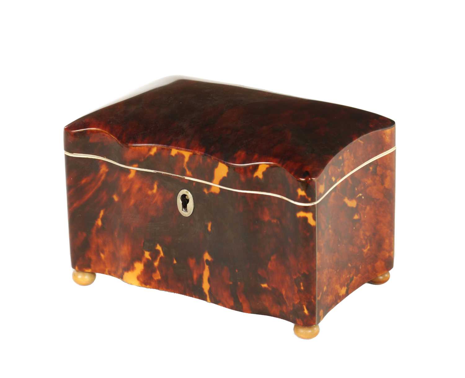 A 19TH CENTURY TORTOISESHELL AND IVORY SERPENTINE SHAPED TEA CADDY