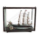 A 19TH CENTURY MODEL OF A TRIPLE MASTED SHIP BEING TUGGED IN BY A STEAMBOAT