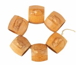 A GOOD SET OF SIX ROBERT 'MOUSEMAN' THOMPSON LIGHT OAK AND SLIGHTLY AZED SERVIETTE RINGS