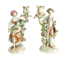 A PAIR OF 19TH CENTURY DERBY FIGURAL CANDLESTICKS