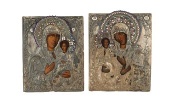 TWO EARLY SILVERED METAL AND ENAMEL DECORATED RUSSIAN ICONS