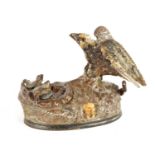 A LATE 19TH CENTURY PAINTED CAST IRON MECHANICAL "EAGLE AND EAGLETS" MONEY BOX DESIGNED BY J & E STE
