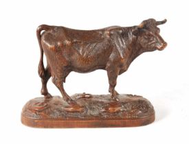 A 19TH CENTURY SWISS BLACK FOREST CARVED LINDEN WOOD COW POSSIBLY BY HUGGLER