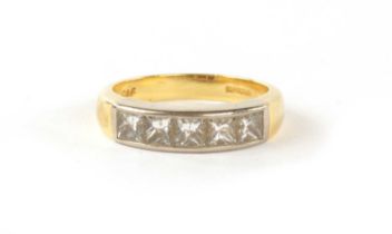 A .750 HALLMARKED YELLOW AND WHITE GOLD MODERN SET DIAMOND RING