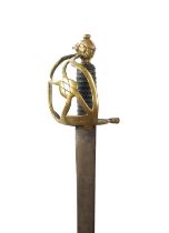 A 18TH CENTURY BRASS HILTED BROADSWORD WITH EAGLE POMMEL