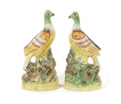 A PAIR OF 19TH CENTURY STAFFORDSHIRE FIGURES