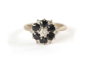 AN 18CT WHITE GOLD DIAMOND AND SAPPHIRE RING