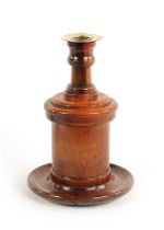 AN UNUSUAL 19TH CENTURY LIGNUM VITAE COMBINED TOBACCO JAR/CANDLESTICK