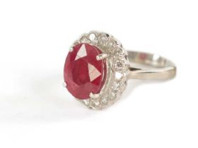 A LADIES 18CT GOLD 4CT RUBY AND DIAMOND RING