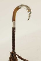 A 19TH CENTURY HORN AND SILVER-TOPPED PARASOL FORMED AS A SWAN'S HEAD