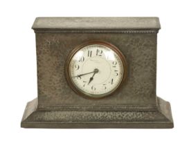 LIBERTY & CO. AN ARTS AND CRAFTS ENGLISH PEWTER MANTEL CLOCK