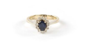 AN 18K WHITE GOLD SAPPHIRE AND DIAMOND DRESS RING