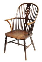 AN EARLY 19TH CENTURY ASH AND ELM WHEEL-BACK WINDSOR CHAIR