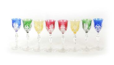 A SET OF EIGHT 20TH CENTURY COLOURED CUT GLASS WINE GLASSES